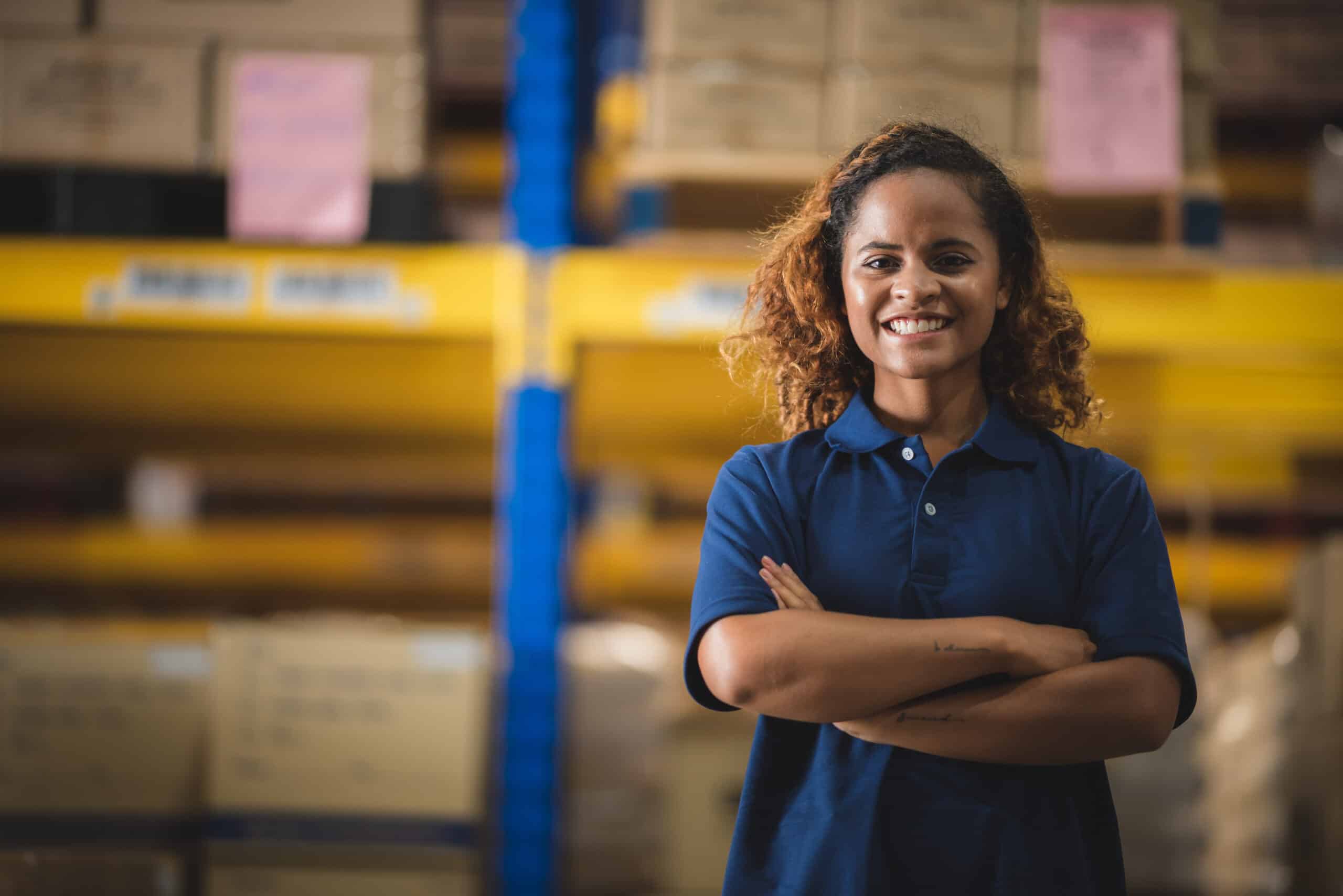 Portrait of African American worker in warehouse, International export business concept.