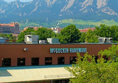 McGuckin Hardware headquarters with visible tree line.
