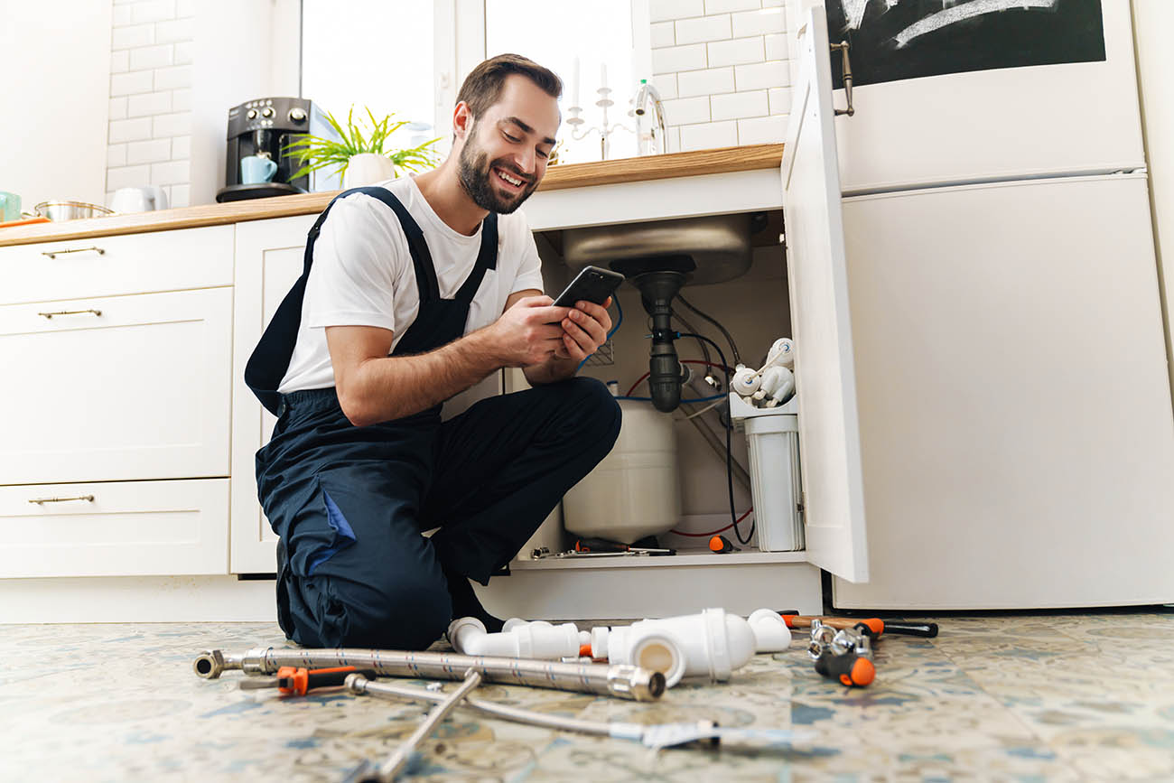 Image,Of,Young,Positive,Smiling,Man,Plumber,Work,In,Uniform plumber